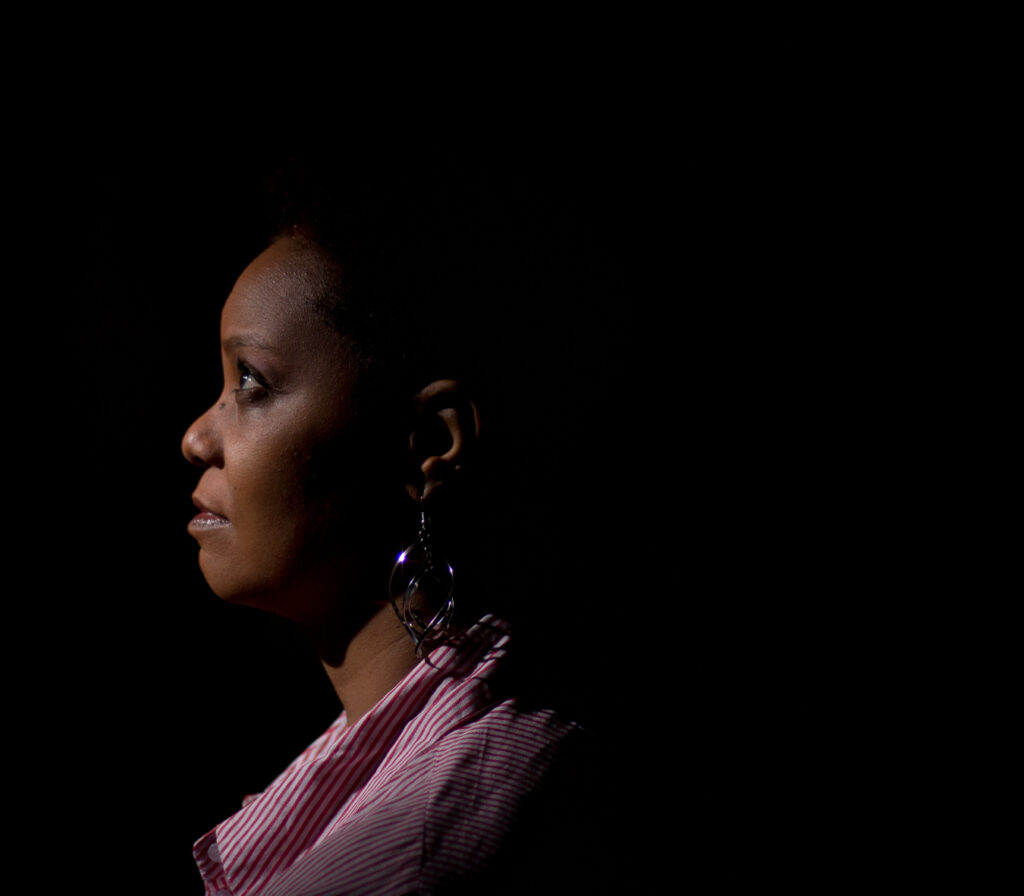 Professional low key lighting head shot of young woman in Metro Atlanta
