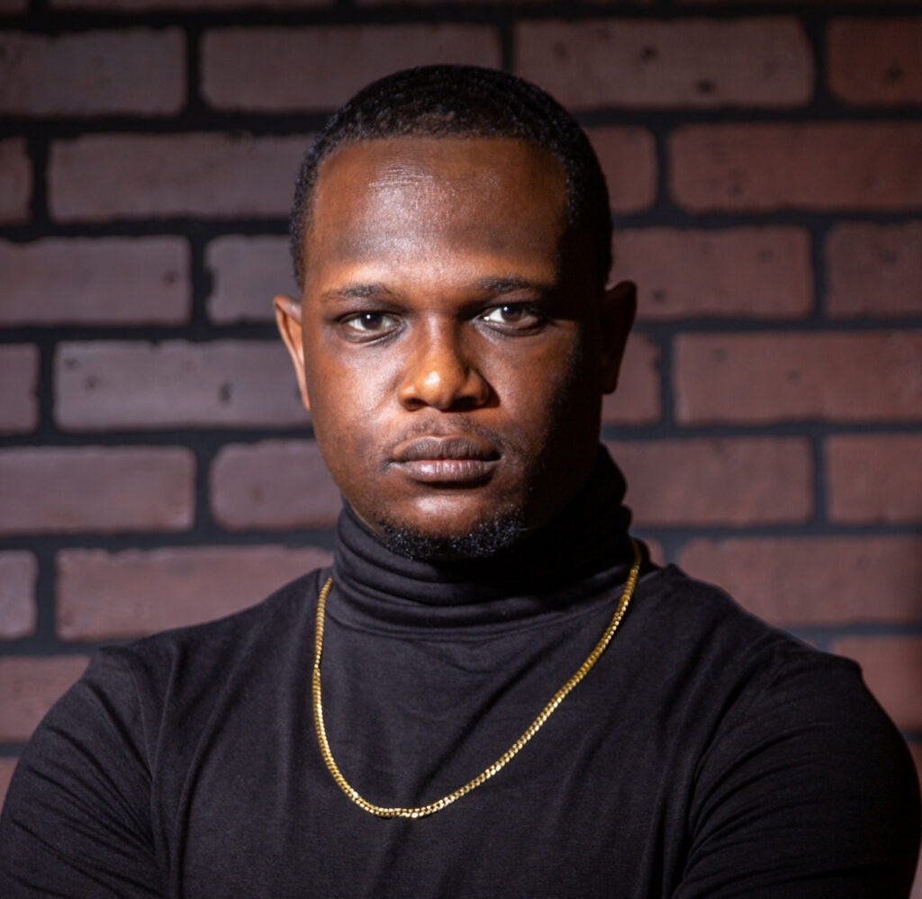 Professional head shot young man in front of brick wall in Metro Atlanta
